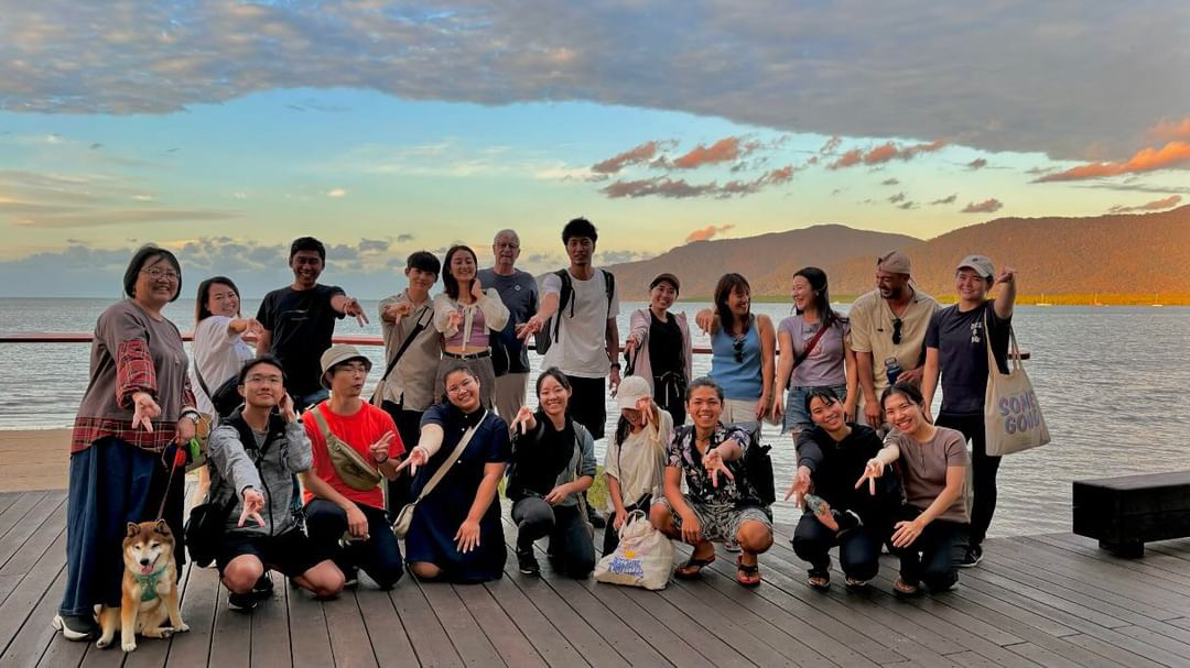 A meetup on the Cairns waterfront at dusk